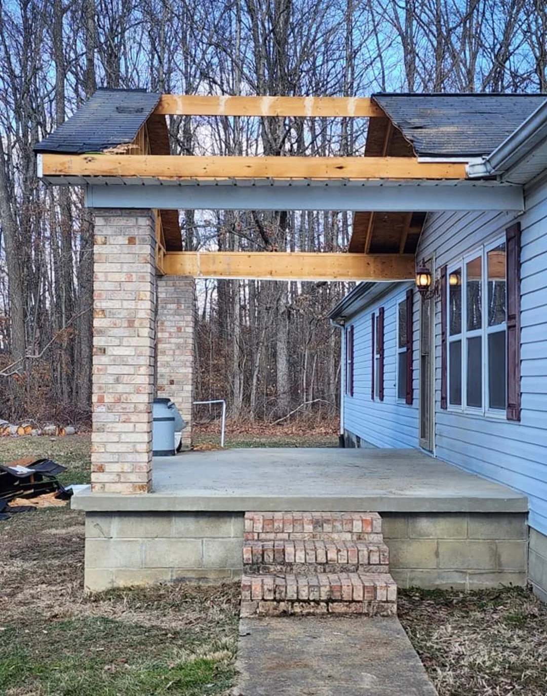 Removing the front porch in preparation for relocating the modular home.